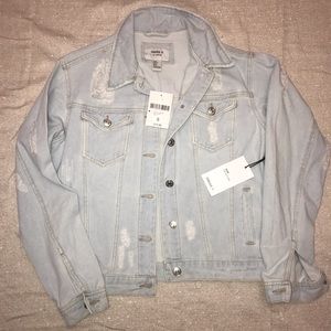 Never worn Light wash distressed denim jacket